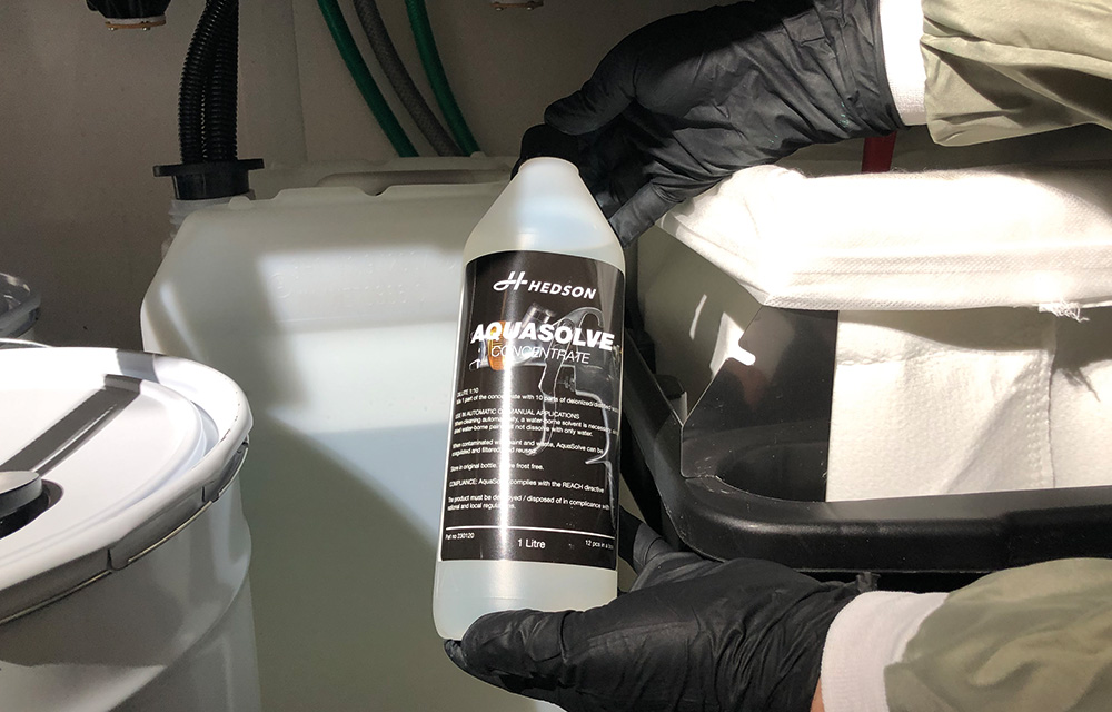 Image of AQUASOLVE, concentrate 1 Liter bottles. Package of 12. pH 7, with anti-corrosive additives to protect the gun.